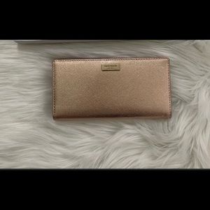 Kate spade laurel way Stacy wallet rose gold.